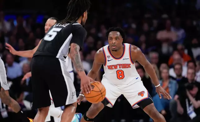 New York Knicks forward Og Anunoby (8) defends against San Antonio Spurs guard Stephon Castle during the first half of Game 3 of the NBA Finals basketball series, Monday, June 8, 2026, in New York. (AP Photo/Ross D. Franklin)
