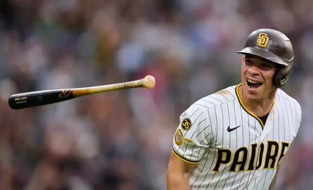 San Diego Padres' Freddy Fermin celebrates after hitting a home run during the third inning of a baseball game against the Cincinnati Reds Monday, June 8, 2026, in San Diego. (AP Photo/Gregory Bull)