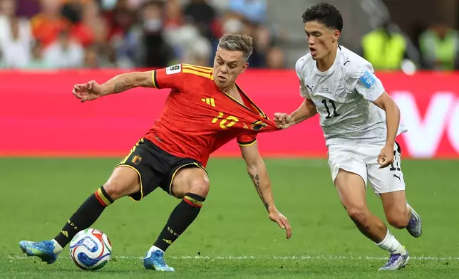New Zealand's Elijah Just (11) pulls on the jersey of Belgium's Leandro Trossard (10) during the World Cup Group G soccer match between New Zealand and Belgium in Vancouver, British Columbia, Friday, June 26, 2026. (AP Photo/Kaleb Tatum)
