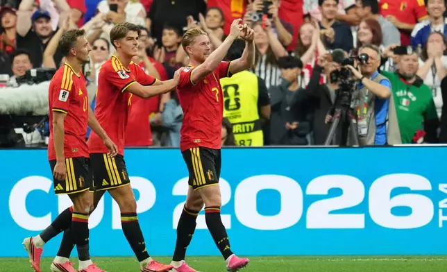 Belgium's Kevin De Bruyne (7) celebrates with teammates after scoring his team's third goal during the World Cup Group G soccer match between New Zealand and Belgium in Vancouver, British Columbia, Friday, June 26, 2026. (AP Photo/Abbie Parr)