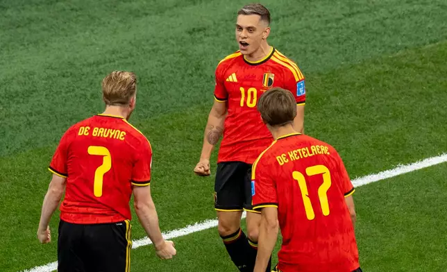 Belgium's Leandro Trossard (10) celebrates his goal against New Zealand with teammates Kevin De Bruyne (7) and Charles De Ketelaere (17) during the first half of a World Cup Group G soccer match, in Vancouver, British Columbia, Friday, June 26, 2026. (Timothy Matwey/The Canadian Press via AP)