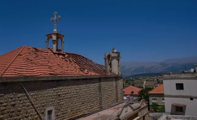 The damaged roof and bell tower of St. George Greek Orthodox Church are seen in the southern town of Marjayoun, Lebanon, Wednesday, June 10, 2026. (AP Photo/Hassan Ammar)