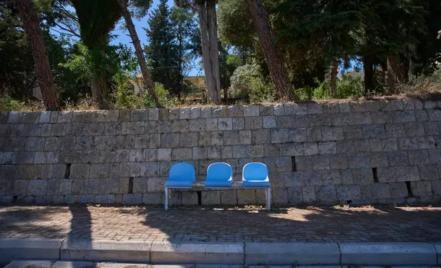 A row of empty seats is seen along a street in the southern town of Marjayoun, Lebanon, Wednesday, June 10, 2026. (AP Photo/Hassan Ammar)