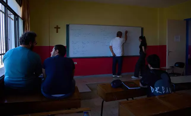 Students attend a mathematics class at a school in the southern village of Qlayaa, Lebanon, Wednesday, June 10, 2026. (AP Photo/Hassan Ammar)