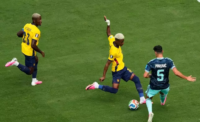 Ecuador's Nilson Angulo (20) maneuvers to score against Germany's Aleksandar Pavlovic (5) during the World Cup Group E soccer match in East Rutherford, N.J., near New York, Thursday, June 25, 2026. (AP Photo/Seth Wenig)
