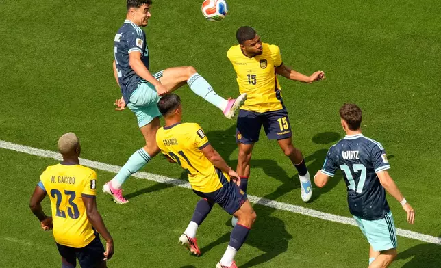 Germany's Aleksandar Pavlovic (5), top left, and Ecuador's Pedro Vite battle for the ball during the World Cup Group E soccer match in East Rutherford, N.J., near New York, Thursday, June 25, 2026. (AP Photo/Seth Wenig)