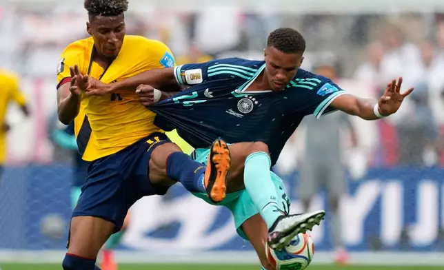 Ecuador's Kevin Rodriguez, left, and Germany's Malick Thiaw battle for the ball during the World Cup Group E soccer match in East Rutherford, N.J., near New York, Thursday, June 25, 2026. (AP Photo/Yuki Iwamura)
