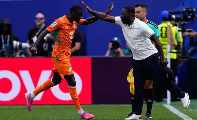 Ivory Coast's Nicolas Pepe (19) celebrates after scoring during the World Cup Group E soccer match between Curacao and Ivory Coast in Philadelphia, Thursday, June 25, 2026. (AP Photo/Petr David Josek)