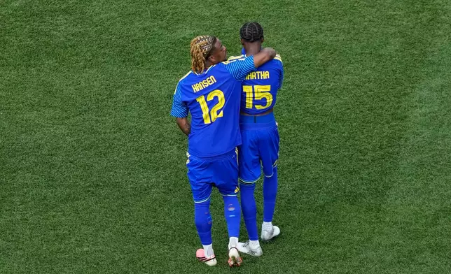 Curaçao's Sontje Hansen (12) and Curaçao's Arjany Martha (15) react after the World Cup Group E soccer match between Curacao and Ivory Coast in Philadelphia, Thursday, June 25, 2026. (AP Photo/Matt Slocum)