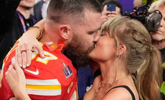 FILE - Kansas City Chiefs tight end Travis Kelce (87) and Taylor Swift kiss after the Chiefs defeated the San Francisco 49ers in the NFL Super Bowl 58 football game on Feb. 11, 2024, in Las Vegas. (AP Photo/John Locher, File)