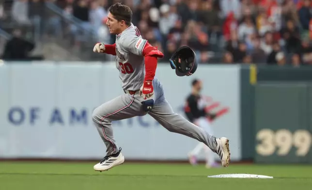 Washington Nationals' Jacob Young rounds the bases after hitting a triple against the San Francisco Giants during the fifth inning of a baseball game in San Francisco, Tuesday, June 9, 2026. (AP Photo/Jed Jacobsohn)