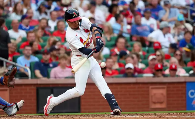St. Louis Cardinals' Masyn Winn hits a two RBI single during the third inning of a baseball game against the Chicago Cubs Sunday, May 31, 2026, in St. Louis. (AP Photo/Scott Kane)