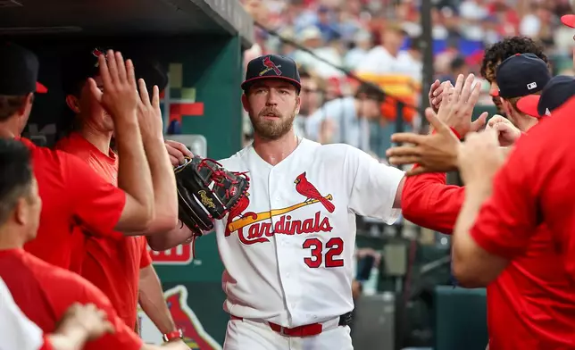 St. Louis Cardinals pitcher Matthew Liberatore is congratulated by teammates after being relieved from the mound during the sixth inning of a baseball game against the Chicago Cubs Sunday, May 31, 2026, in St. Louis. (AP Photo/Scott Kane)