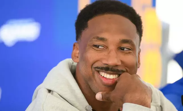 Los Angeles Rams defensive end Myles Garrett smiles during a press conference following the NFL football team's practice, Tuesday, June 2, 2026, in Woodland Hills, Calif. (AP Photo/Kyusung Gong)