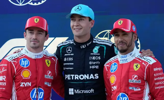 Mercedes driver George Russell of Britain, center, pole position, is flanked by second fastest time Ferrari driver Charles Leclerc of Monaco, led an third fastest time Ferrari driver Lewis Hamilton of Britain after the qualifying session ahead of the Austrian F1 Grand Prix, in Spielberg, Austria, Saturday, June 27, 2026. (AP Photo/Darko Bandic)