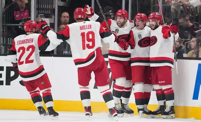 Carolina Hurricanes right wing Jackson Blake, second from right, celebrates his goal with teammates during the second period in Game 6 of the NHL hockey Stanley Cup Final series against the Vegas Golden Knights, Sunday, June 14, 2026, in Las Vegas. (AP Photo/John Locher)
