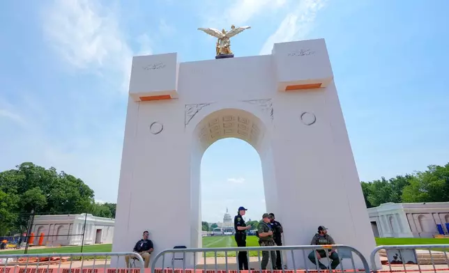 An arch is pictured as preparations continue for the Great American State Fair on the National Mall, Monday, June 22, 2026, in Washington. (AP Photo/Mariam Zuhaib)