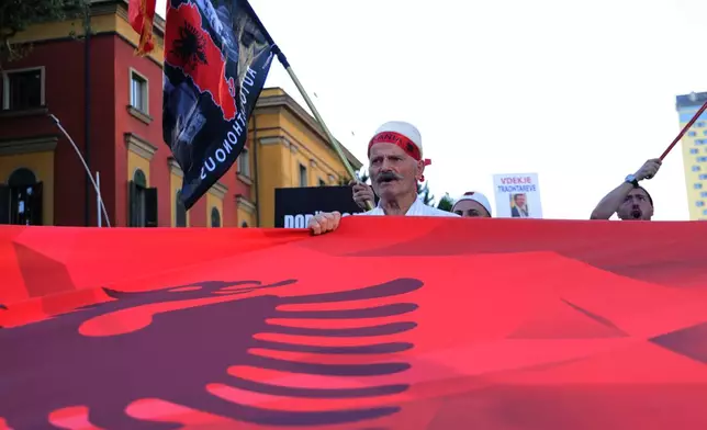 Protesters take part in a rally in Tirana, Albania, Tuesday, June 9, 2026, against the construction of a massive coastal development project linked to Jared Kushner and Ivanka Trump at Narta lagoon area, western Albania. (AP Photo/Hameraldi Agolli)