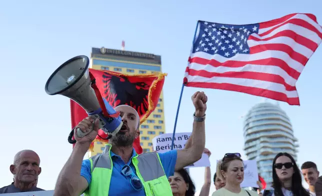 Protesters take part in a rally in Tirana, Albania, Tuesday, June 9, 2026, against the construction of a massive coastal development project linked to Jared Kushner and Ivanka Trump at Narta lagoon area, western Albania. (AP Photo/Hameraldi Agolli)
