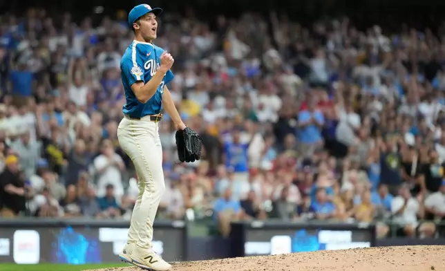 Milwaukee Brewers' Jacob Misiorowski reacts after striking out a Philadelphia Phillies batter during the eighth inning of a baseball game Friday, June 12, 2026, in Milwaukee. (AP Photo/Aaron Gash)