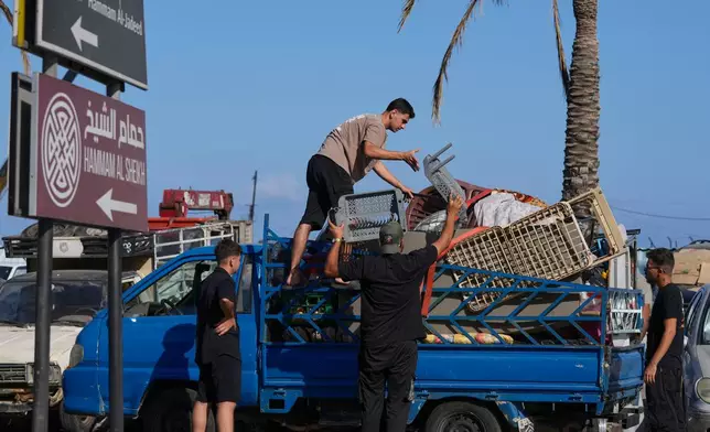 Displaced people pack their belongings as they prepare to return to their village following the announcement of an initial ceasefire agreement between the United States and Iran, in the southern port city of Sidon, Lebanon, Monday, June 15, 2026. (AP Photo/Mohammed Zaatari)