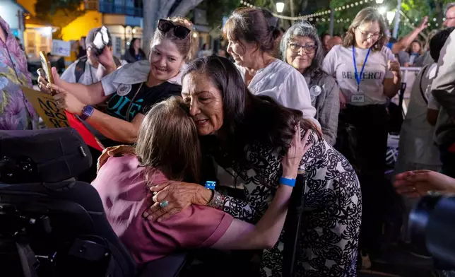 Democratic gubernatorial candidate Deb Haaland hugs and greets supporters following her speech during a primary election night watch party after winning the Democratic nomination, Tuesday, June 2, 2026, in Albuquerque, New Mexico. (AP Photo/Jon Austria)