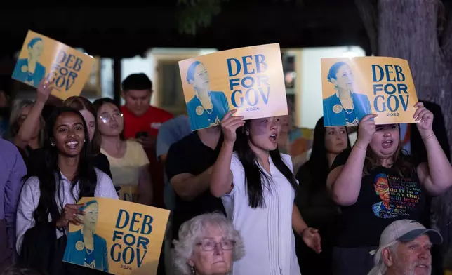 Supporters of Democratic gubernatorial candidate Deb Haaland cheer her on during her speech during an primary election night watch party after winning the Democratic nomination Tuesday, June 2, 2026, in Albuquerque, New Mexico. (AP Photo/Jon Austria)