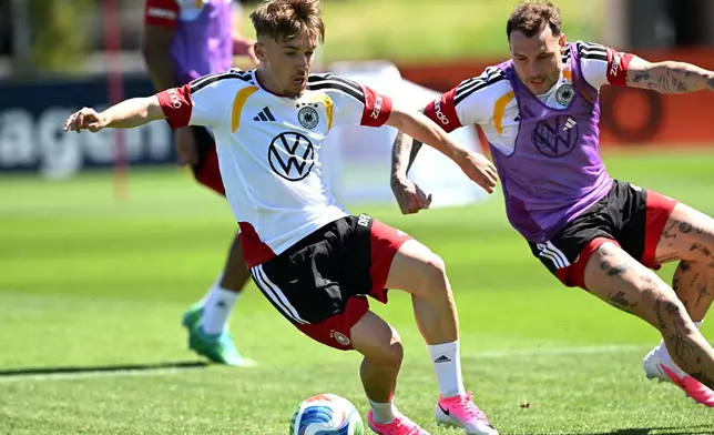 Germany's Lennart Karl, left, and David Raum attend a training session in Herzogenaurach, Germany, Thursday May 28, 2026, ahead of the World Cup tournament. (Federico Gambarini/dpa via AP)