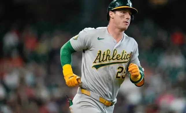 Athletics designated hitter Brent Rooker rounds the bases after hitting a solo home run against the Houston Astros during the fifth inning of a baseball game, Sunday, June 7, 2026, in Houston. (AP Photo/Eric Christian Smith)