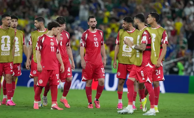 Tunisia players react after the World Cup Group F soccer match between Sweden and Tunisia in Guadalupe, near Monterrey, Mexico, Sunday, June 14, 2026. (AP Photo/Moises Castillo)