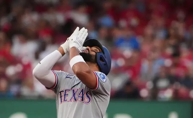Texas Rangers' Ezequiel Duran celebrates after hitting an RBI double during the fourth inning of a baseball game against St. Louis Cardinals Monday, June 1, 2026, in St. Louis. (AP Photo/Jeff Roberson)