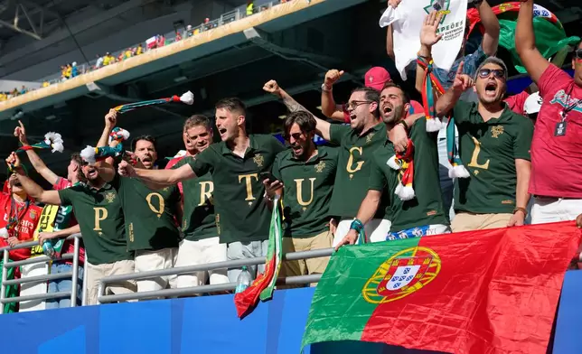 Portuguese supporters react before the World Cup Group K soccer match between Colombia and Portugal in Miami Gardens, Fla., Saturday, June 27, 2026. (AP Photo/Lynne Sladky)