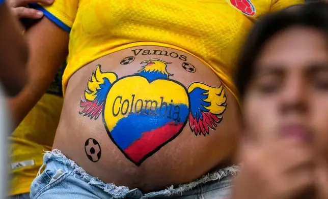 A supporter has her stomach painted in Colombia colours before the World Cup Group K soccer match between Colombia and Portugal in Miami Gardens, Fla., Saturday, June 27, 2026. (AP Photo/Lynne Sladky)