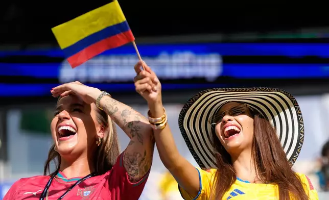 A Colombia and Portuguese supporter react before the World Cup Group K soccer match between Colombia and Portugal in Miami Gardens, Fla., Saturday, June 27, 2026. (AP Photo/Lynne Sladky)