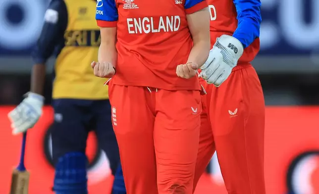 England's Freya Kemp celebrates taking the wicket of Sri Lanka's Harshitha Samarawickrama during the ICC Women's T20 World Cup, Group 2 match at between England and Sri Lanka at Edgbaston, Birmingham, England, Friday, June 12, 2026. (Nigel French/PA via AP)