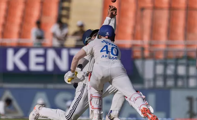 India's Dhruv Jurel fields a shot by Afghanistan's Afsar Zazai on day two of the cricket test match between Afghanistan and India in New Chandigarh, India, Sunday, June 7, 2026. (AP Photo/Ashwini Bhatia)