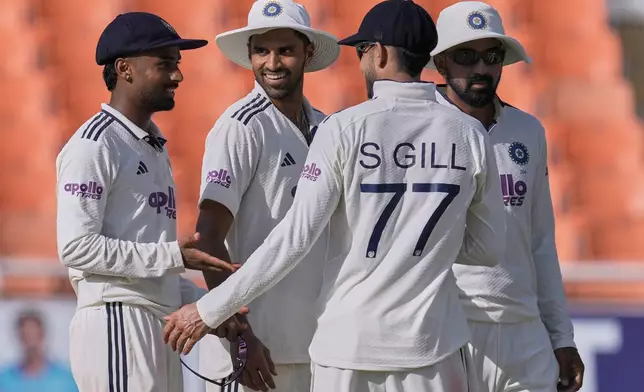 India's Manav Suthar, left, celebrates with teammates the wicket of Afghanistan's Afsar Zazai on day two of the cricket test match between Afghanistan and India in New Chandigarh, India, Sunday, June 7, 2026. (AP Photo/Ashwini Bhatia)