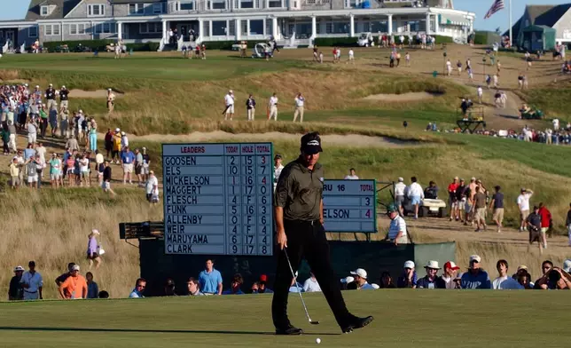 FILE - Phil Mickelson walks around his putt on 17 during the final round of the U.S. Open golf tournament at Shinnecock Hills Golf Club on June 20, 2004, in Southampton, N.Y. (AP Photo/David Duprey, File)