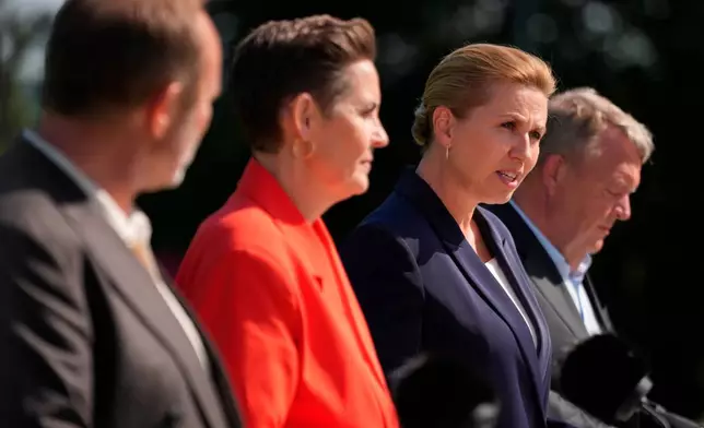 Party leaders Martin Lidegaard (The Social Liberal Party), Pia Olsen Dyhr (SF), incoming Danish Prime Minister Mette Frederiksen (Social Democrats), and Lars Loekke Rasmussen (Moderates) present the government platform for a new government in Denmark, at Marienborg in Kongens Lyngby, Tuesday, June 2, 2026. (Mads Claus Rasmussen/Ritzau Scanpix via AP)