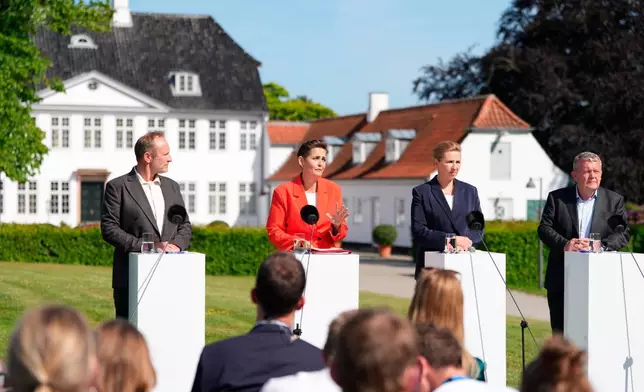 Party leaders Martin Lidegaard (The Social Liberal Party), Pia Olsen Dyhr (SF), incoming Prime Minister Mette Frederiksen (Social Democrats), and Lars Loekke Rasmussen (Moderates) present the government platform for a new government in Denmark, at Marienborg in Kongens Lyngby, Tuesday, June 2, 2026. (Mads Claus Rasmussen/Ritzau Scanpix via AP)