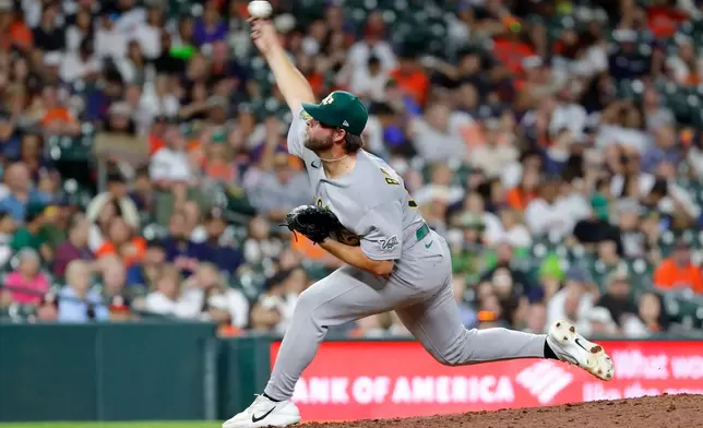 Athletics relief pitcher Mason Barnett throws against the Houston Astros during the fifth inning of a baseball game Friday, June 5, 2026, in Houston. (AP Photo/Michael Wyke)