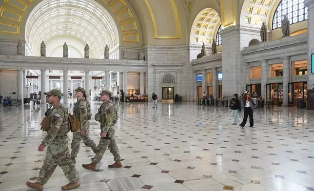 FILE - Members of the National Guard walking in the lobby of Union Station in Washington, May 27, 2026. (AP Photo/Matt Rourke, file)