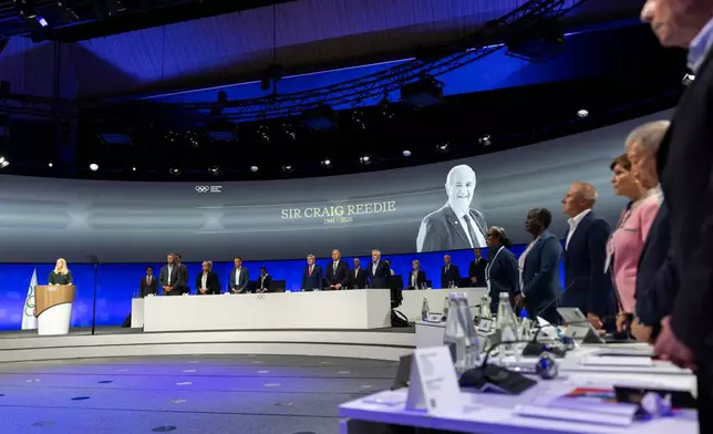 International Olympic Committee (IOC) President Kirsty Coventry, takes part in a minute silence, during the 146th Session of the International Olympic Committee (IOC) at the SwissTech Convention Centre, in Lausanne, Switzerland, Wednesday, June 24, 2026. (Cyril Zingaro/Keystone via AP)