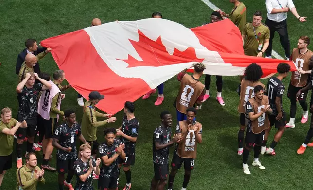 Players of Canada celebrate after the World Cup round of 32 soccer match against South Africa in Inglewood, Calif., near Los Angeles, Sunday, June 28, 2026. (AP Photo/Marcio Sanchez)