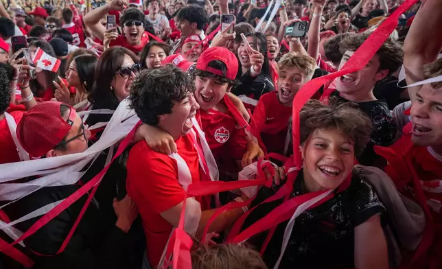 Canadian fans celebrate after Canada defeated South Africa during a World Cup round of 32 soccer match, at FIFA Fan Fest in Vancouver, Sunday, June 28, 2026. (Darryl Dyck/The Canadian Press via AP)