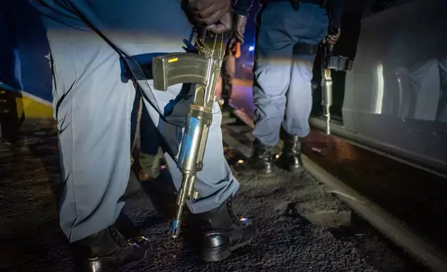 FILE - Police patrol an area in Soweto, South Africa, July 12, 2022 in search of illegal firearms following a deadly bar shooting. (AP Photo, File)