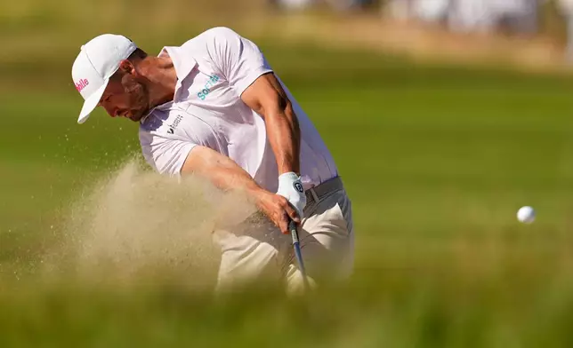 Wyndham Clark hits from the bunker on the eighth hole during the final round of the U.S. Open golf tournament at Shinnecock Hills Golf Club in Southampton, N.Y., Sunday, June 21, 2026. (AP Photo/George Walker IV)