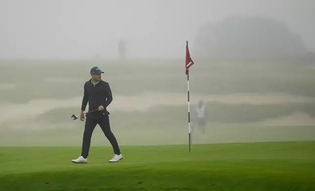Matthew Jordan off the green after play was suspended during the first round of the U.S. Open golf tournament at Shinnecock Hills Golf Club in Southampton, N.Y., Thursday, June 18, 2026.(AP Photo/David J. Phillip)