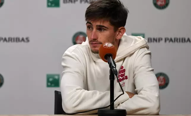 Italy's Matteo Arnaldi holds a press conference after witdrowing from a semifinal match due to an injury at the French Open in Paris, Friday, June 5, 2026. (AP Photo/Thibault Camus)