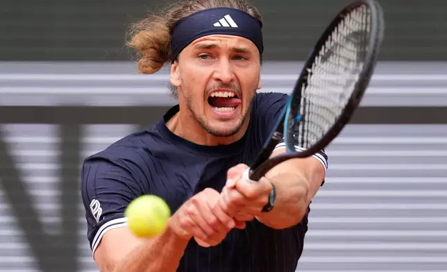 Germany's Alexander Zverev returns to Czech Republic's Jakub Mensik during the semifinal tennis match at the French Open in Paris, Friday, June 5, 2026. (AP Photo/Christophe Ena)